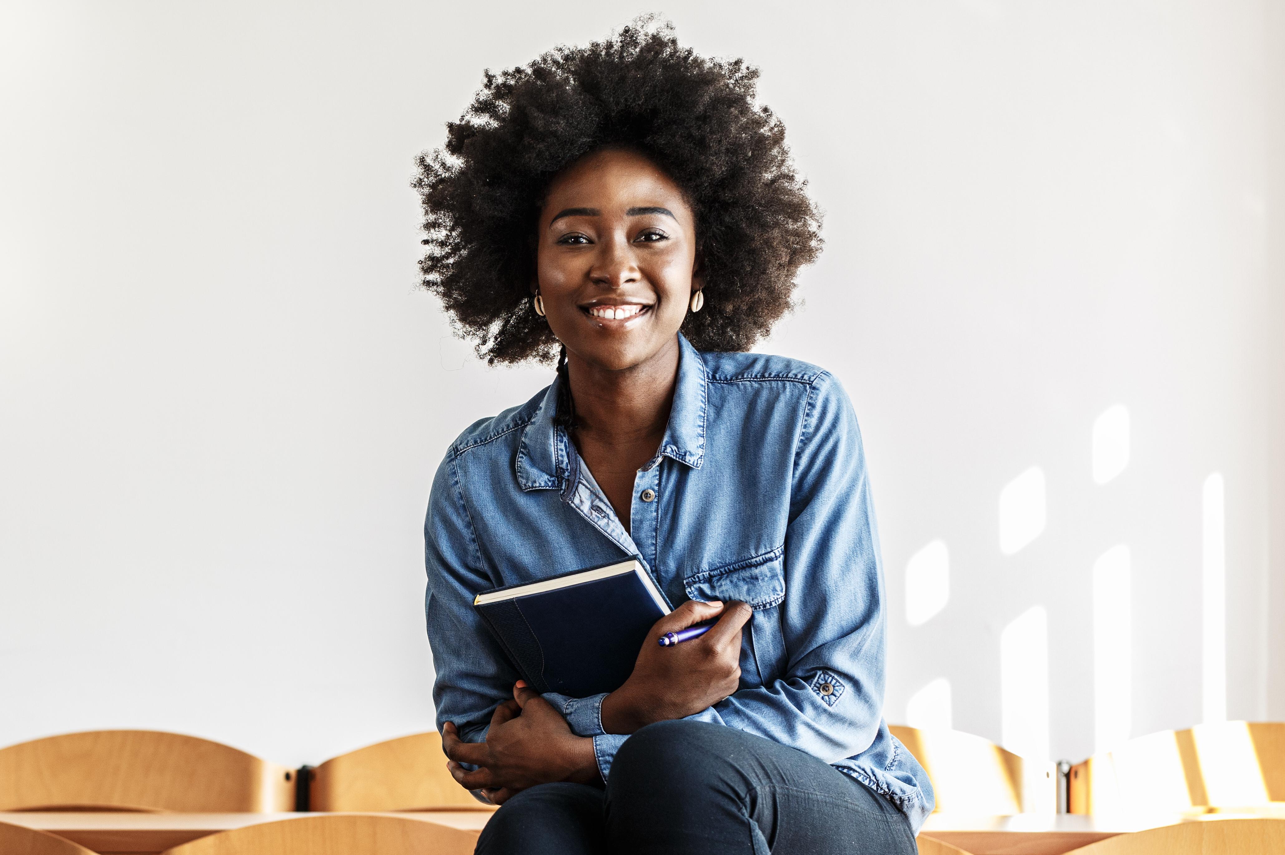 female student in empty classroom