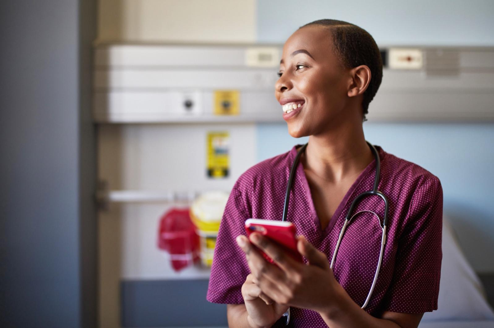 Photo of female nurse happily working in a healthcare setting