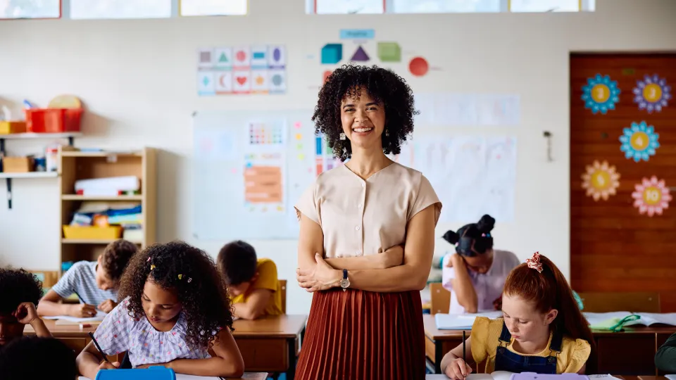 Teacher smiling in classroom
